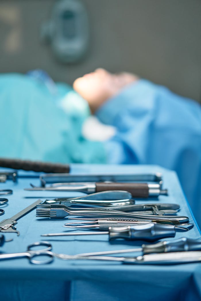 Close-up of surgical tools in an operating room setting, emphasizing precision and sterility.